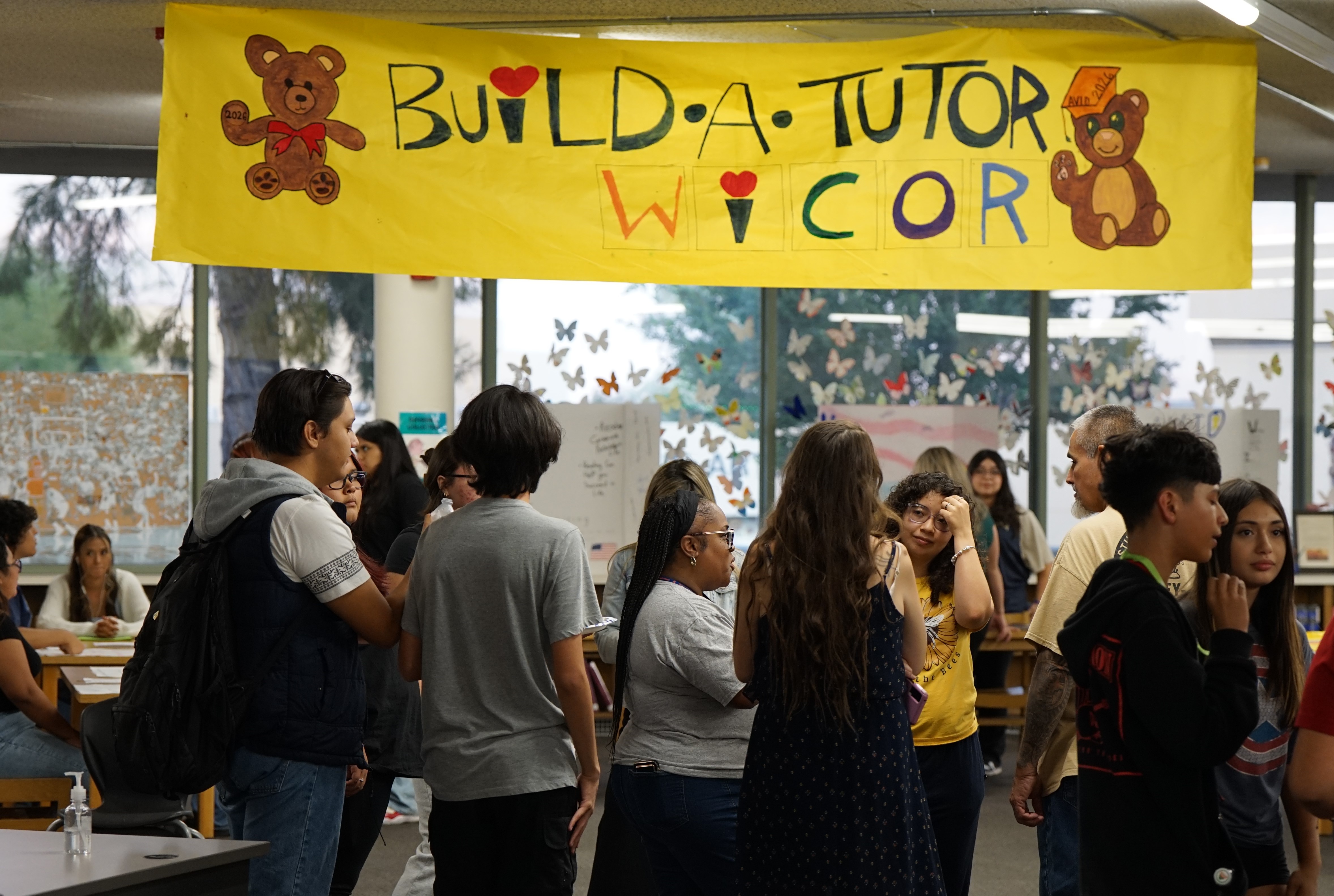 Students line up under the Build a Tutor WICOR banner