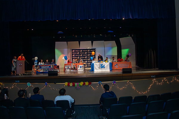Students on stage during the signing day ceremony