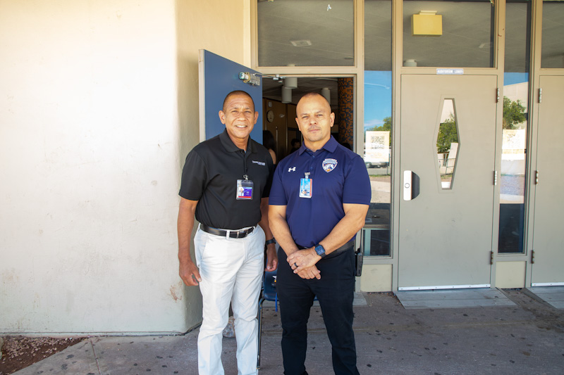 Dr. Trujillo and Cholla's principal smile outside the school