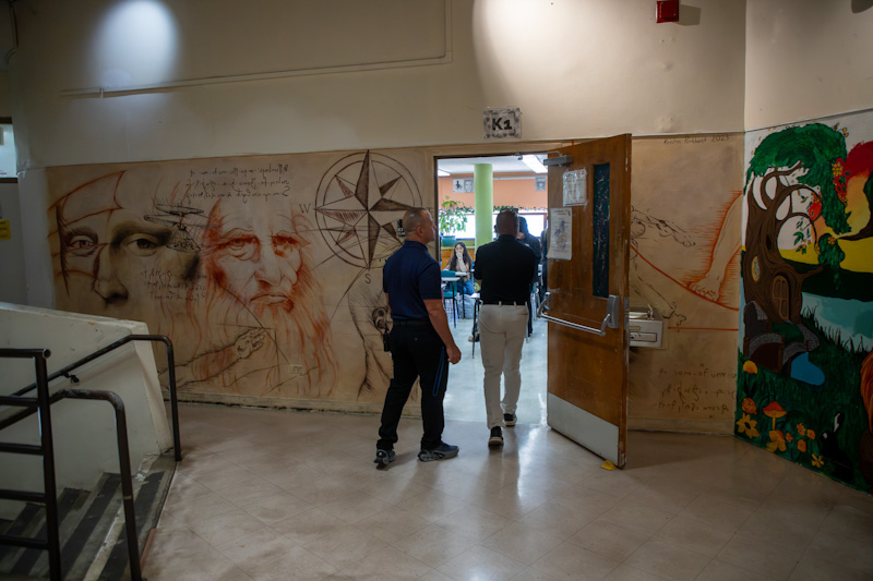 Cholla's principal and Dr. Trujillo walk into a classroom