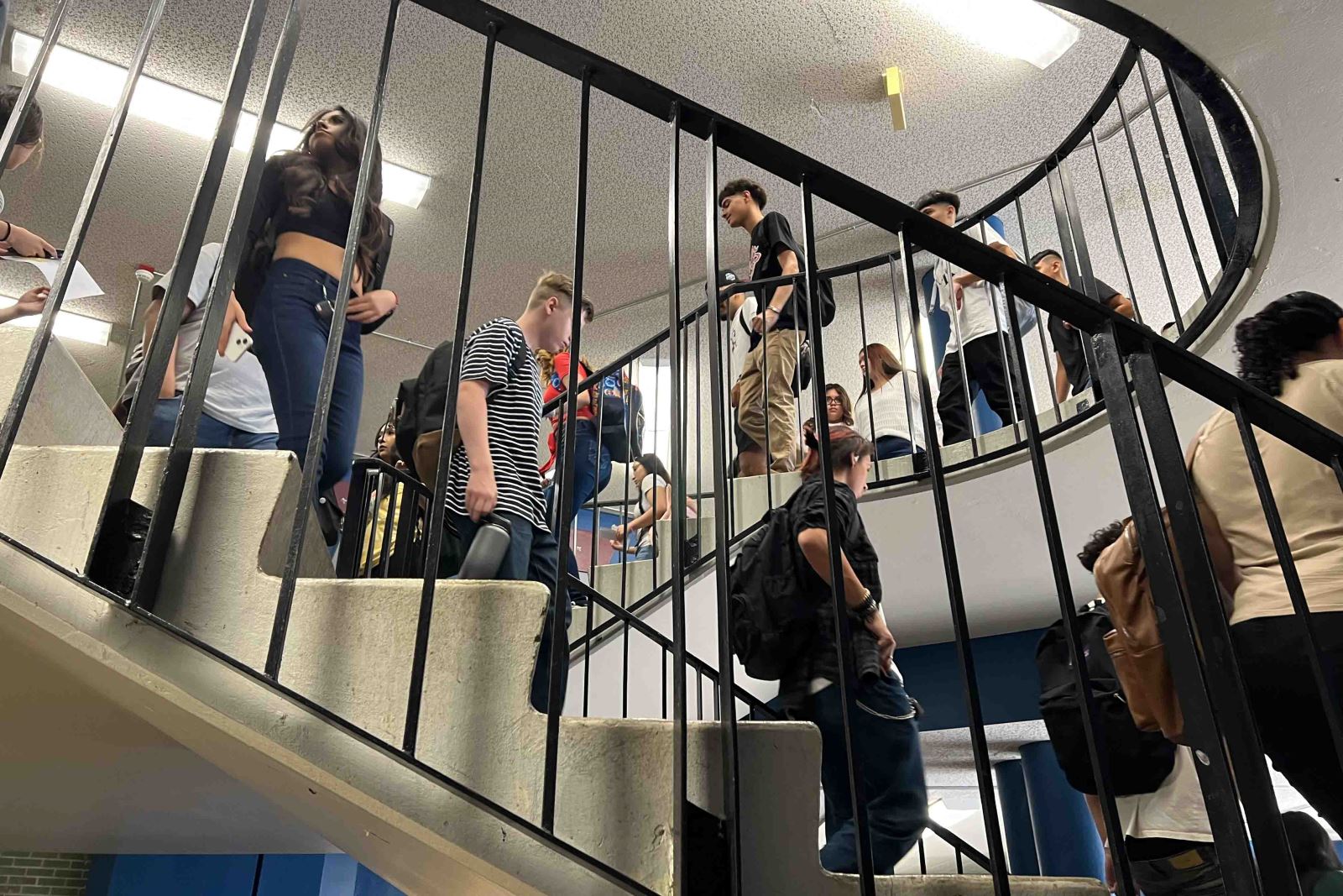 Cholla students move up and down the staircase on the first day of school
